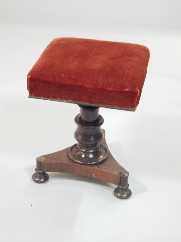 Appraisal: An early Victorian rosewood adjustable piano stool with a red