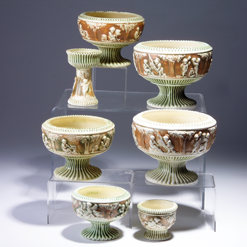 Appraisal: Seven ROSEVILLE Donatello footed vessels the tallest the smallest Hairline