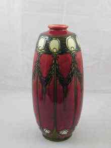 Appraisal: A tall vase of elongated barrel form tube lined in