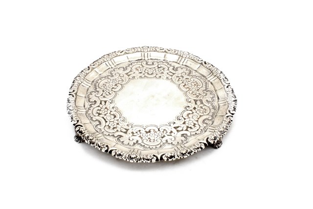 Appraisal: A George III silver shaped circular salver decorated with a