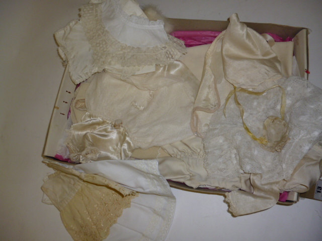 Appraisal: A quantity of dolls' clothing in cream white lace cotton