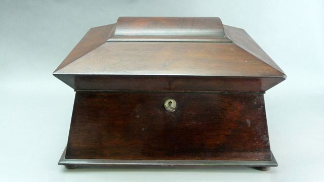 Appraisal: A Regency mahogany work box of sarcophagus form with original