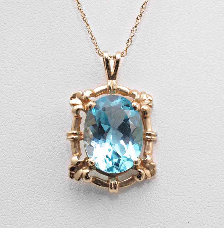 Appraisal: K GOLD TOPAZ PENDANT K yellow gold pendant contains one