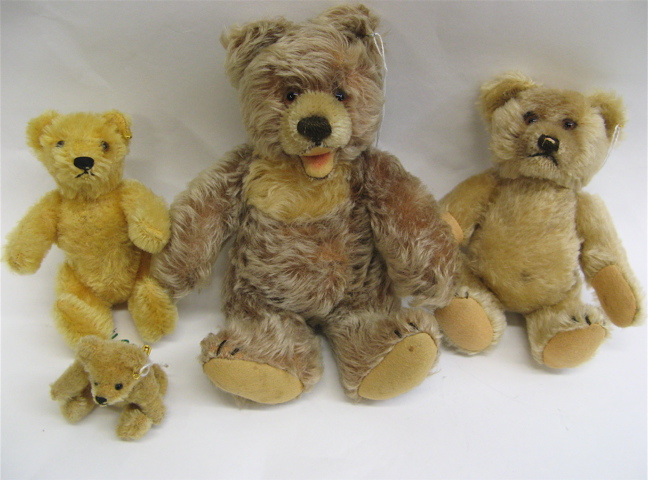 Appraisal: FOUR GERMAN STEIFF TEDDY BEARS having various shades of brown