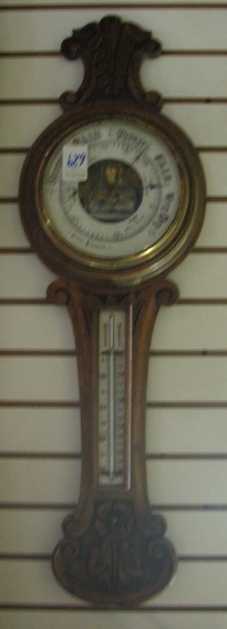 Appraisal: CARVED OAK BANJO BAROMETER-THERMOMETER English c The banjo-shaped oak case