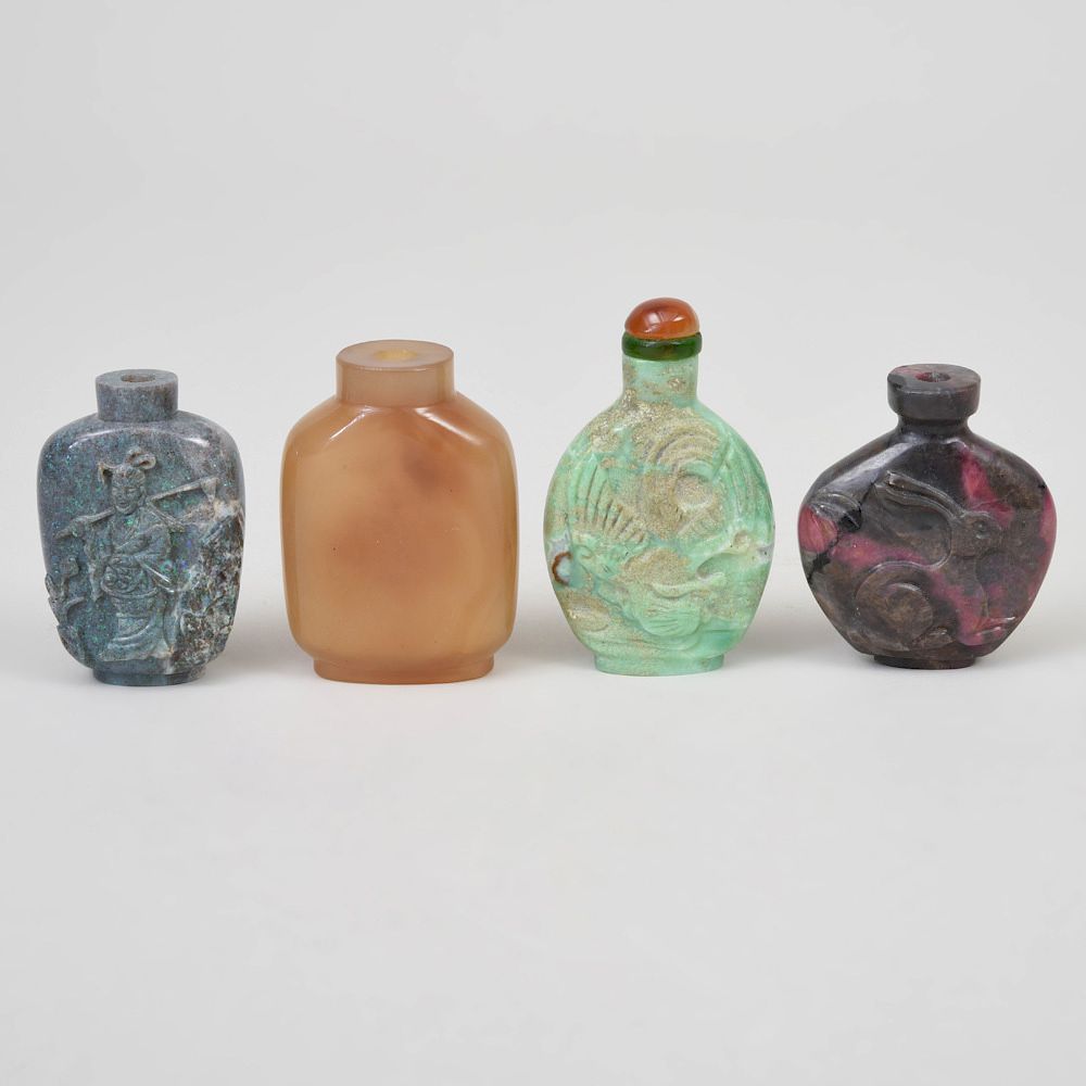 Appraisal: Four Chinese Carved Hardstone Snuff Bottles Comprising An agate example