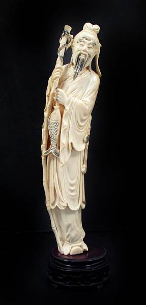 Appraisal: A carved ivory figure of an old bearded fisherman height