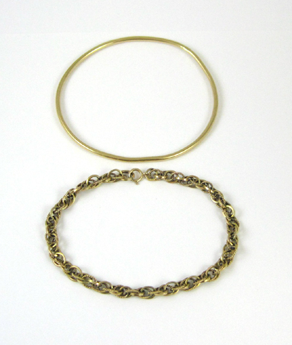 Appraisal: TWO FOURTEEN KARAT GOLD BRACELETS including an oval yellow gold