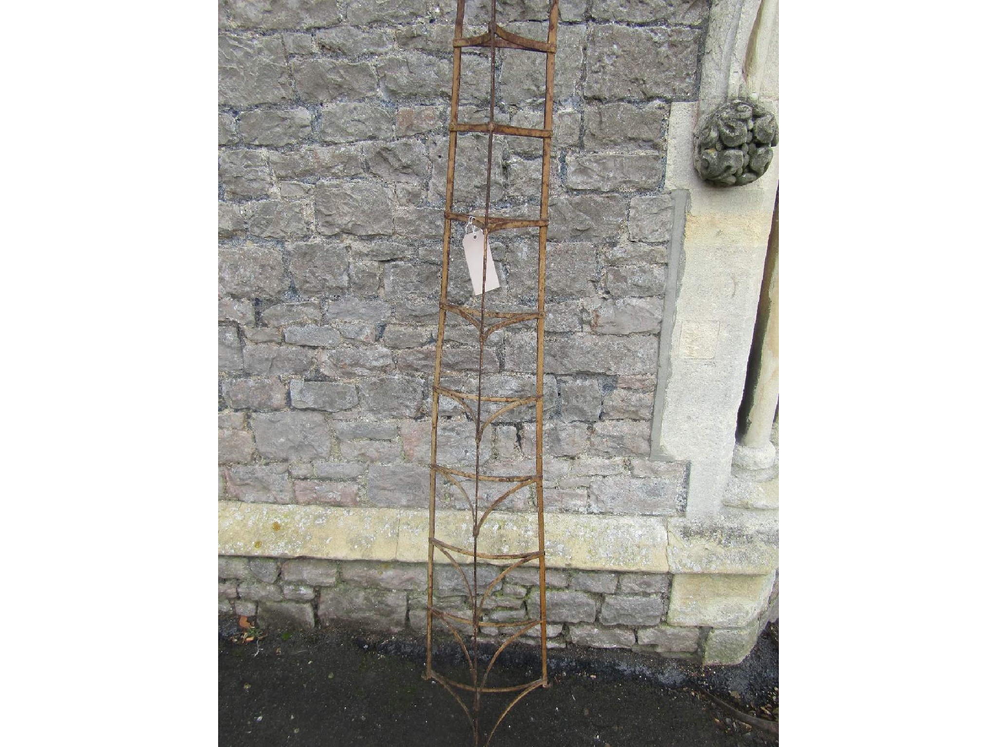 Appraisal: A vintage floor standing painted steel eight tier graduated saucepan