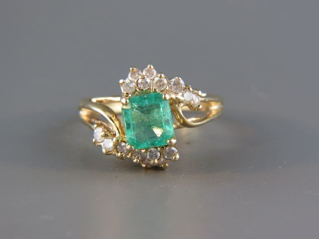 Appraisal: Emerald Diamond Ring elegant gem weighing carats and round diamonds