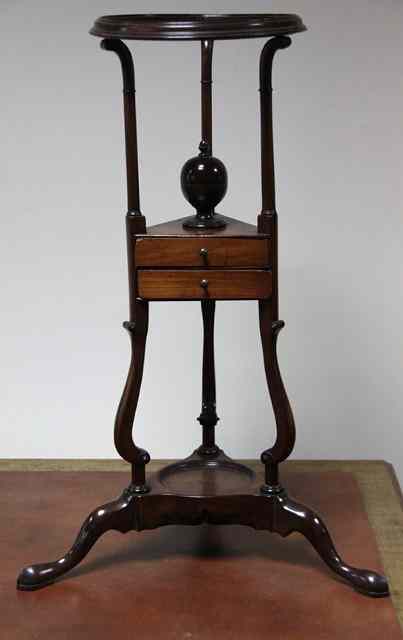 Appraisal: A George III style mahogany washstand the circular top above