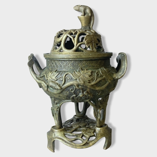 Appraisal: A Chinese Bronze tripod censer with stand cover Relief decorated