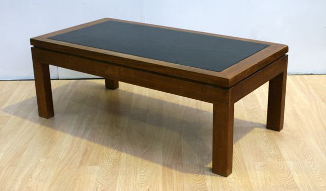 Appraisal: A contemporary maple coffee table with leather inset cm long