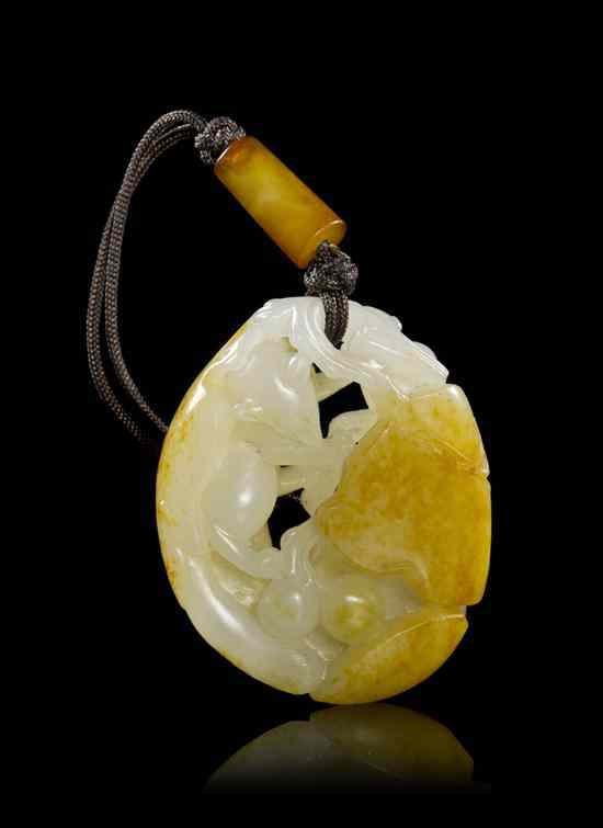 Appraisal: A Chinese White Jade Pebble-Form Toggle of even colored stone