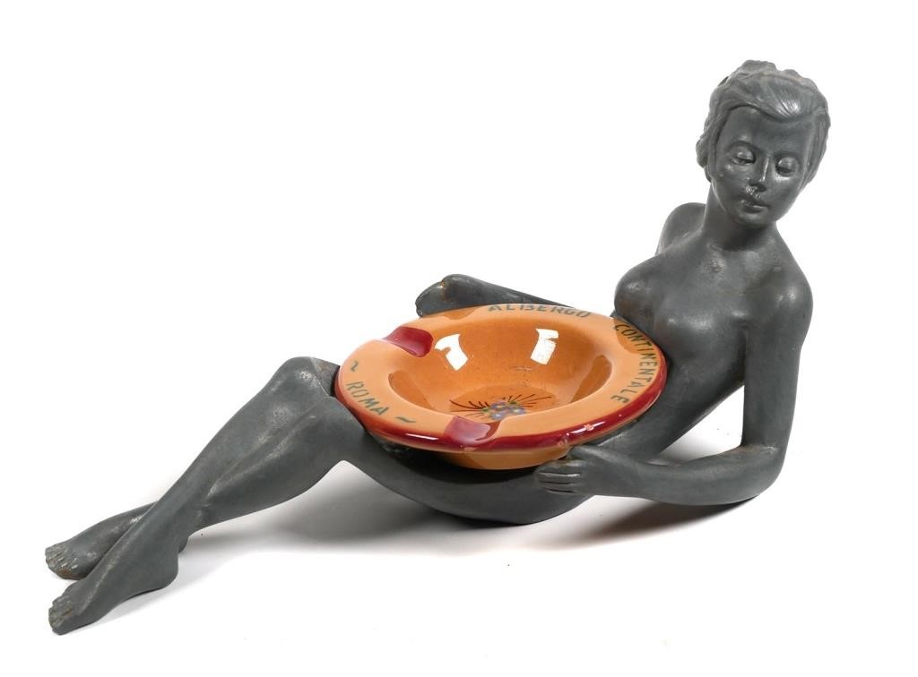 Appraisal: Clay ashtray seated in the cast metal body of a