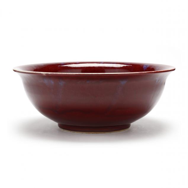 Appraisal: A LARGE CHINESE SANG DE BOEUF GLAZED BOWL th century