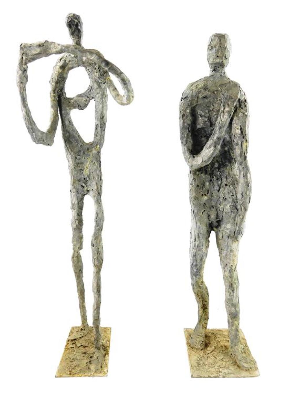 Appraisal: Two metal standing figures modern design with highly textured surface