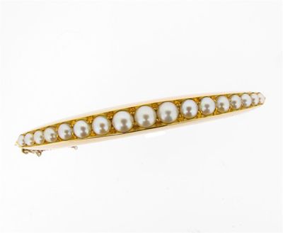 Appraisal: An Edwardian graduated half pearl mounted gold bangle