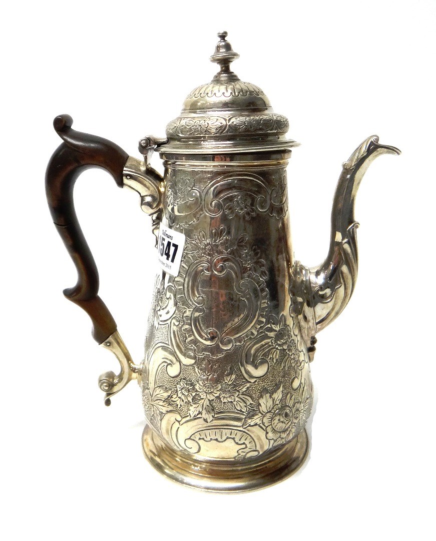 Appraisal: A silver coffee pot of tapering cylindrical form with floral