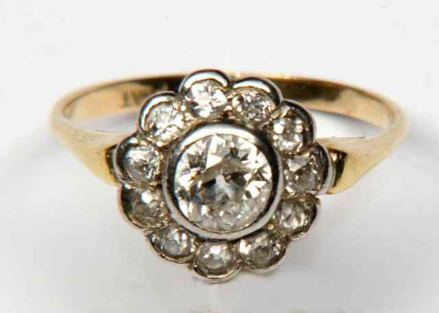 Appraisal: AN CT GOLD AND PLATINUM LADIES RING with central diamond