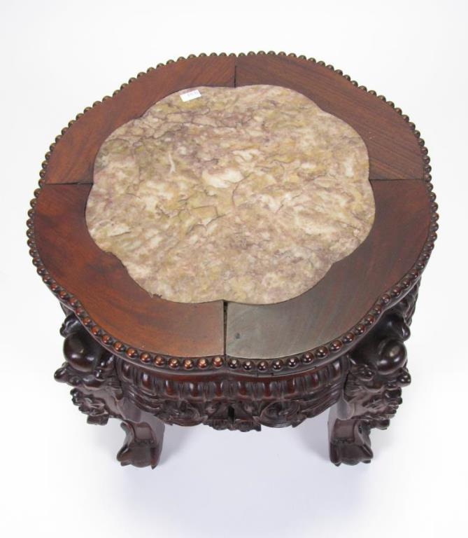 Appraisal: A carved rosewood Oriental stand with marble insert top x