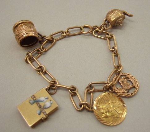 Appraisal: A gold bar and circular link bracelet on a boltring