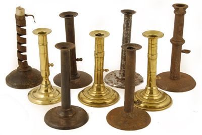 Appraisal: A pair of brass candlesticks with side handle extractors in