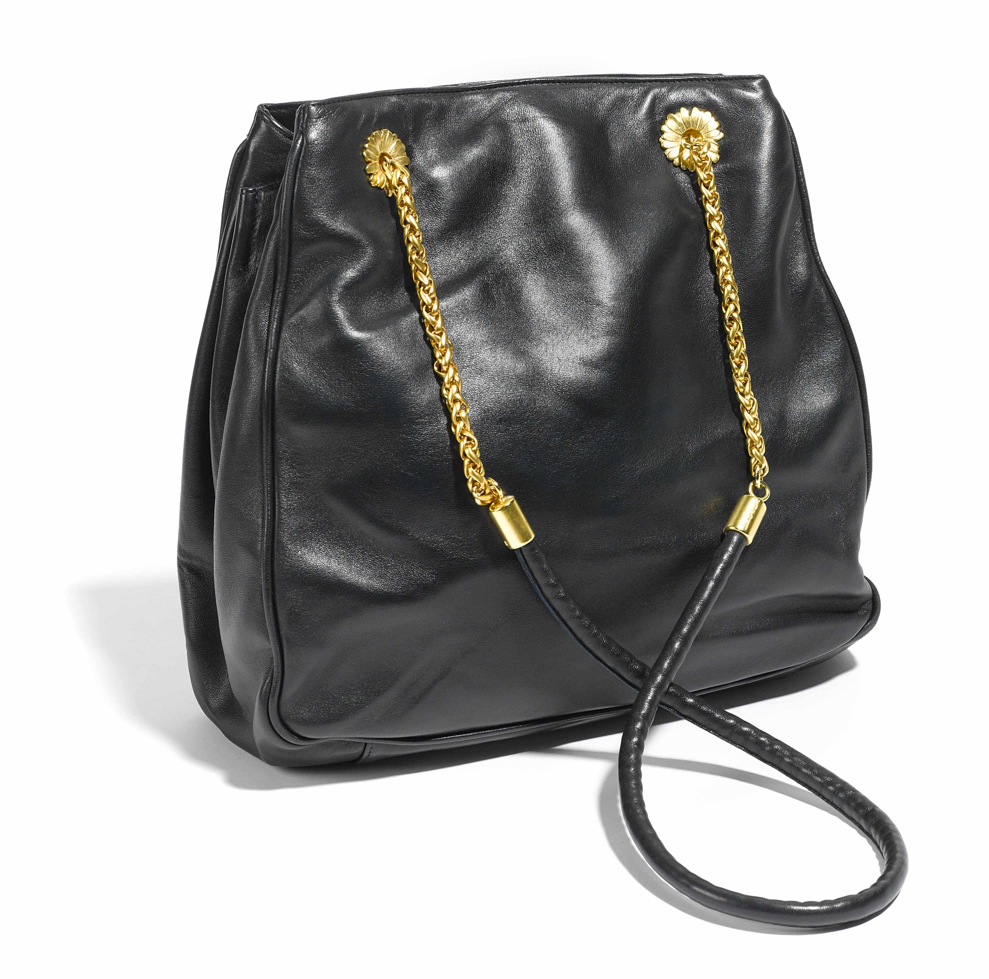 Appraisal: An Escada black leather handbag with gold metal hardware and