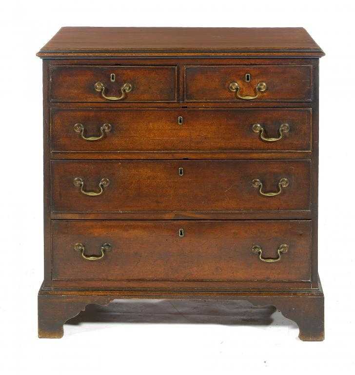 Appraisal: A GEORGE III MAHOGANY CHEST OF DRAWERS the top with