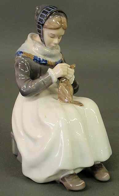 Appraisal: Royal Copenhagen figure of a seated woman mending h x