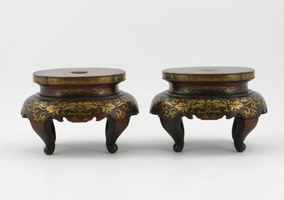 Appraisal: A pair of Japanese hardwood and brass inlaid stands on