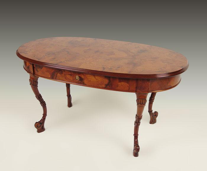 Appraisal: OVAL MARQUETRY COCKTAIL COFFEE TABLE Butterfly veneer with Dutch style