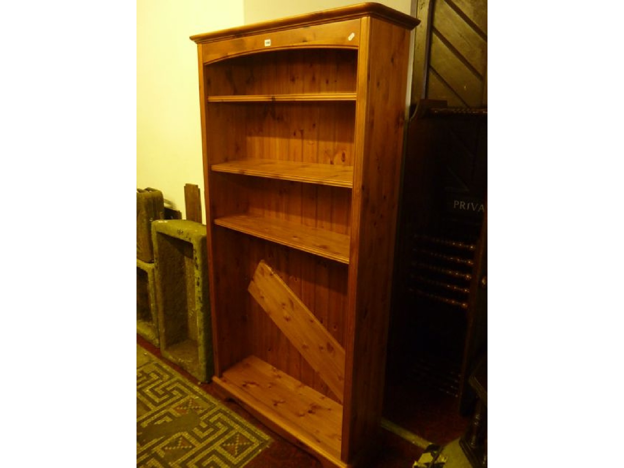 Appraisal: A modern stripped pine freestanding open bookcase with four adjustable