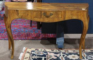 Appraisal: Italian olive wood console table having a shaped top above