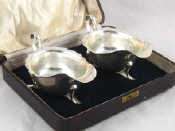 Appraisal: A pair of silver sauce boats in fitted case E