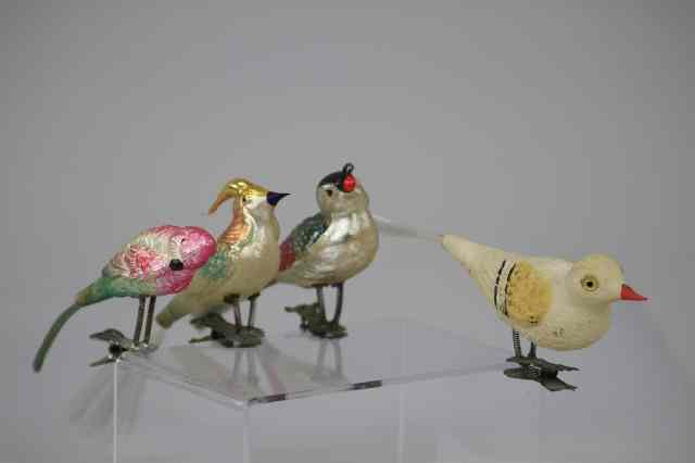 Appraisal: GLASS BIRDS WITH SPUN GLASS TAILS Four German clip on