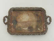 Appraisal: A large two handled silver plated tray with engraved decoration