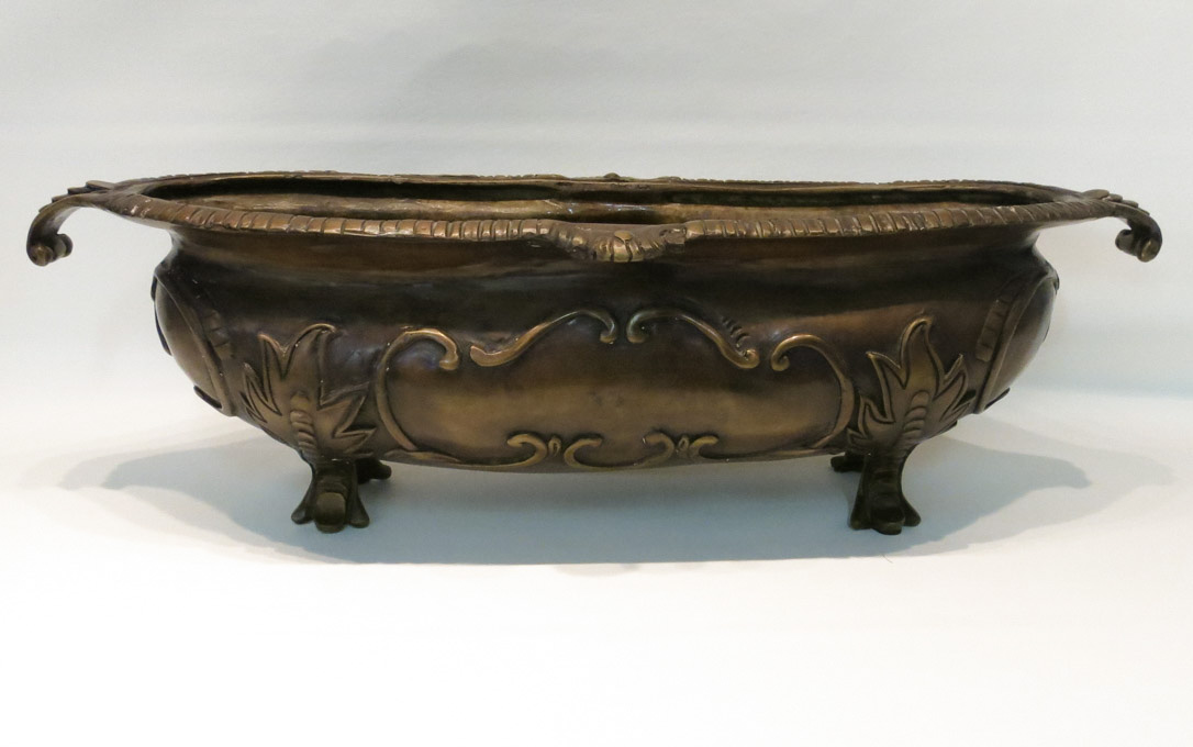 Appraisal: PATINATED BRONZE JARDINIERE of oval form with scroll handles and