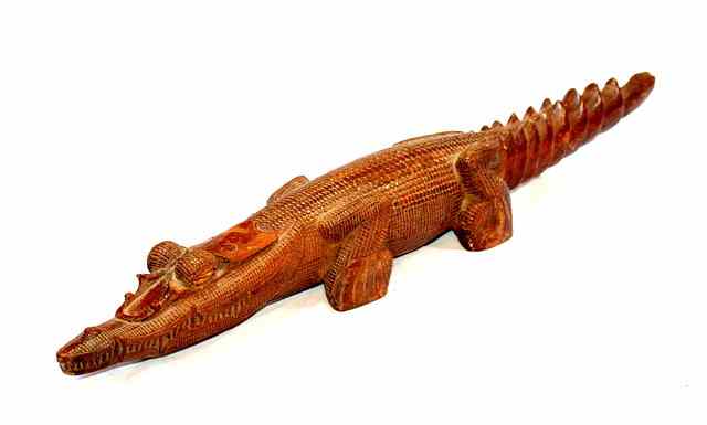 Appraisal: A PAPUA NEW GUINEA MIDDLE SEPIK CARVED WOOD ANCESTOR CROCODILE