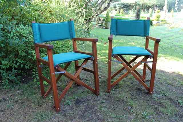 Appraisal: A SET OF EIGHT TEAK FOLDING GREEN UPHOLSTERED DIRECTORS TYPE