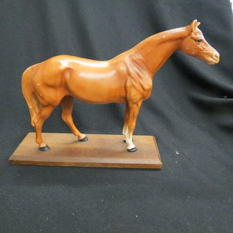 Appraisal: Hubley Cast Iron Figurine of a Horse wooden base all