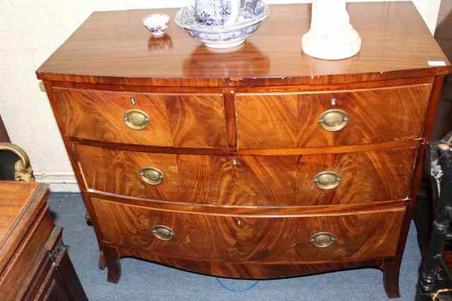 Appraisal: A MAHOGANY BOW FRONTED CHEST of two short and two