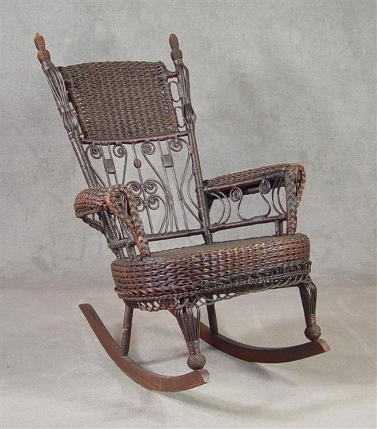 Appraisal: Wicker Rocker Circa Cane seat In old dark brown finish