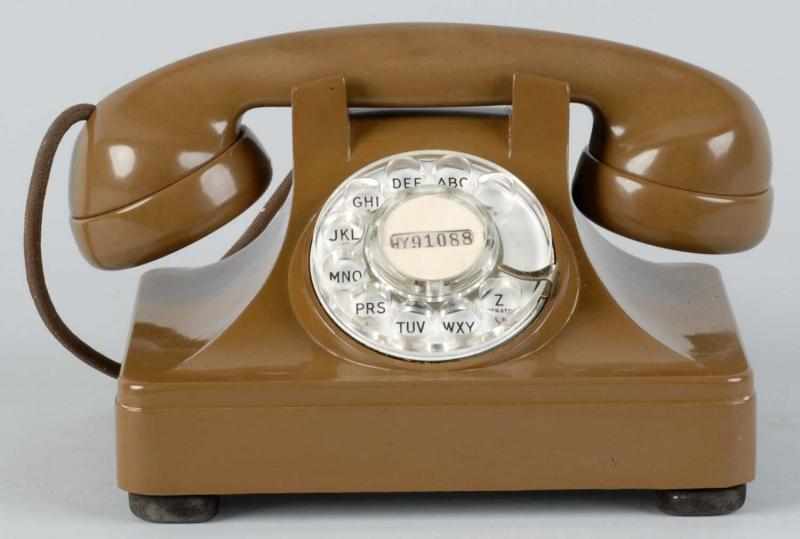 Appraisal: North Cradle Telephone Description Circa Phone is chocolate brown plastic