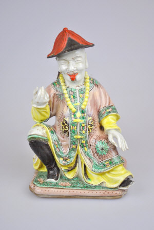 Appraisal: Chinese biscuit figure of a seated man wearing traditional robes