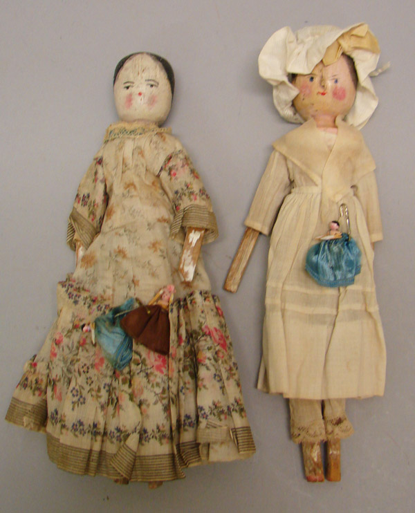 Appraisal: Pair of vintage peg woodens each holding their peg wooden