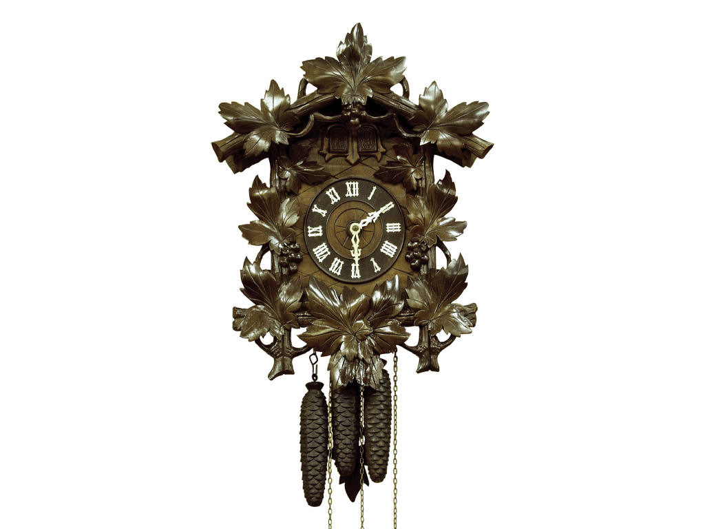 Appraisal: Black Forest wall cuckoo clock in oak leaf design featuring