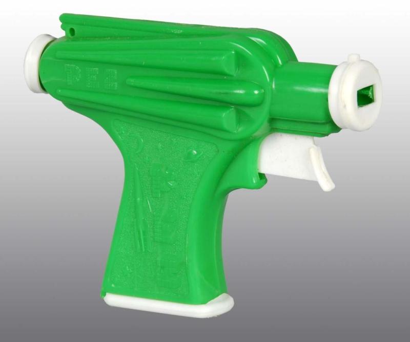 Appraisal: Space Gun Pez Dispenser Description Green variation Includes original instruction