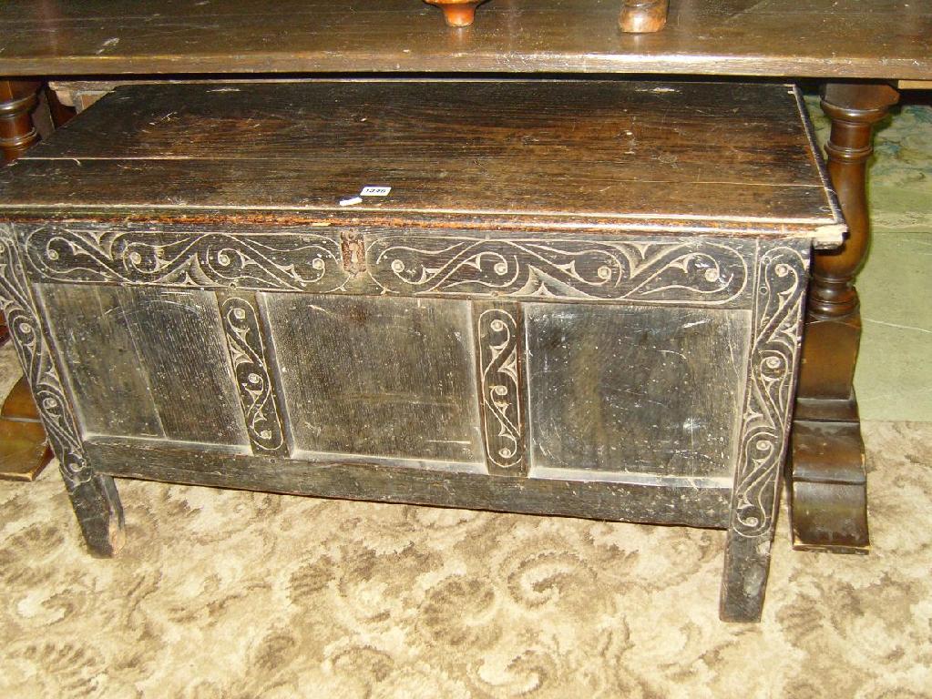 Appraisal: A Georgian oak coffer with carved front elevation