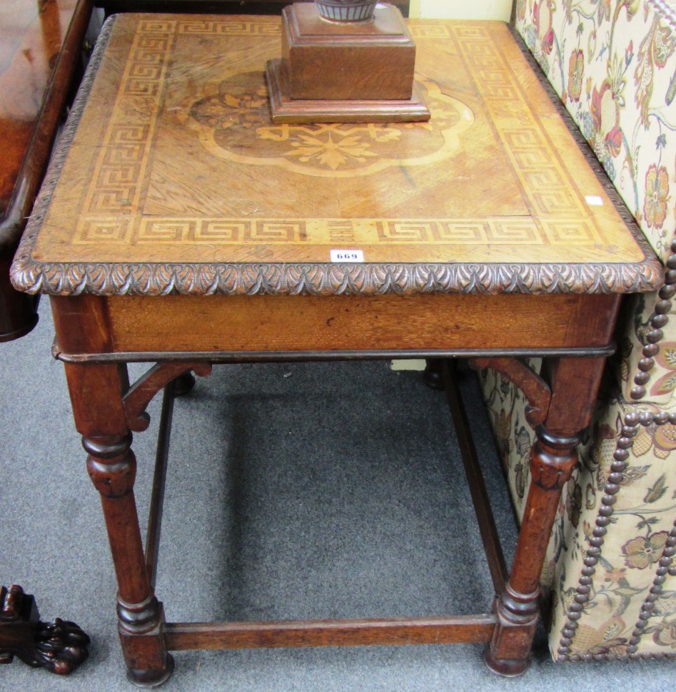 Appraisal: A German oak and fruitwood marquetry inlaid centre table on